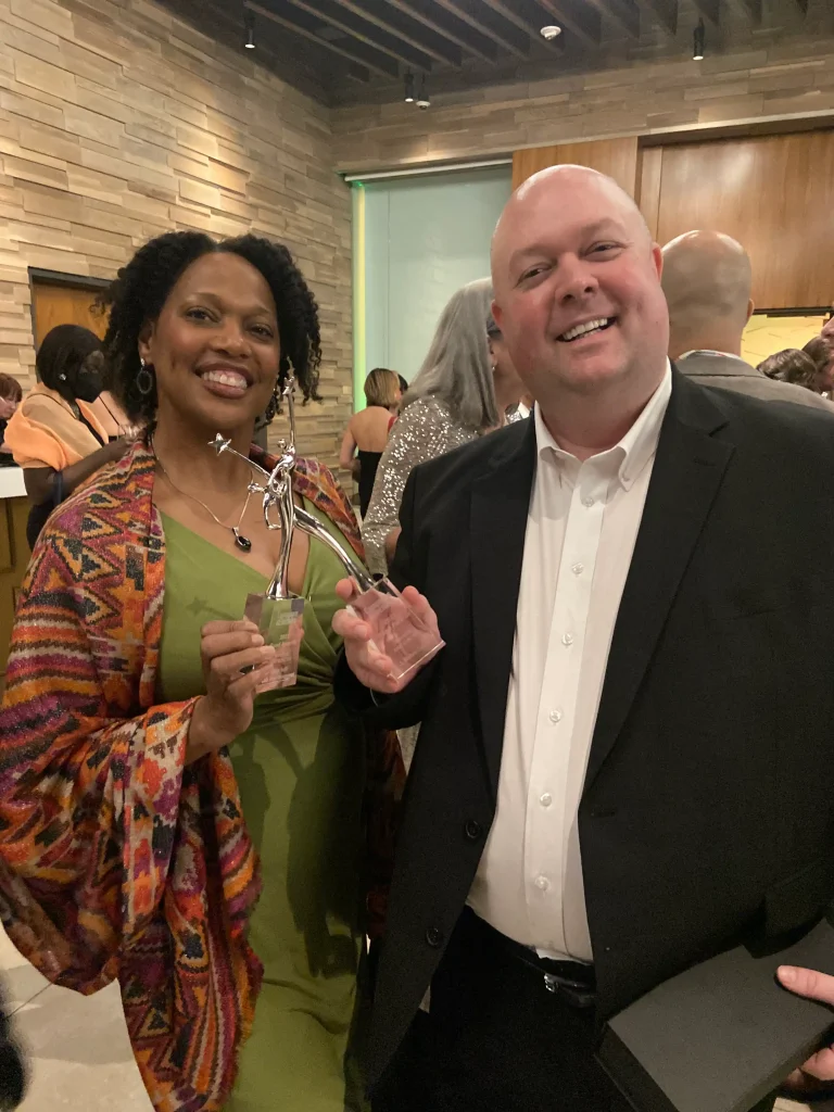 Soraya Butler and J Michael Collins winning Reed Awards